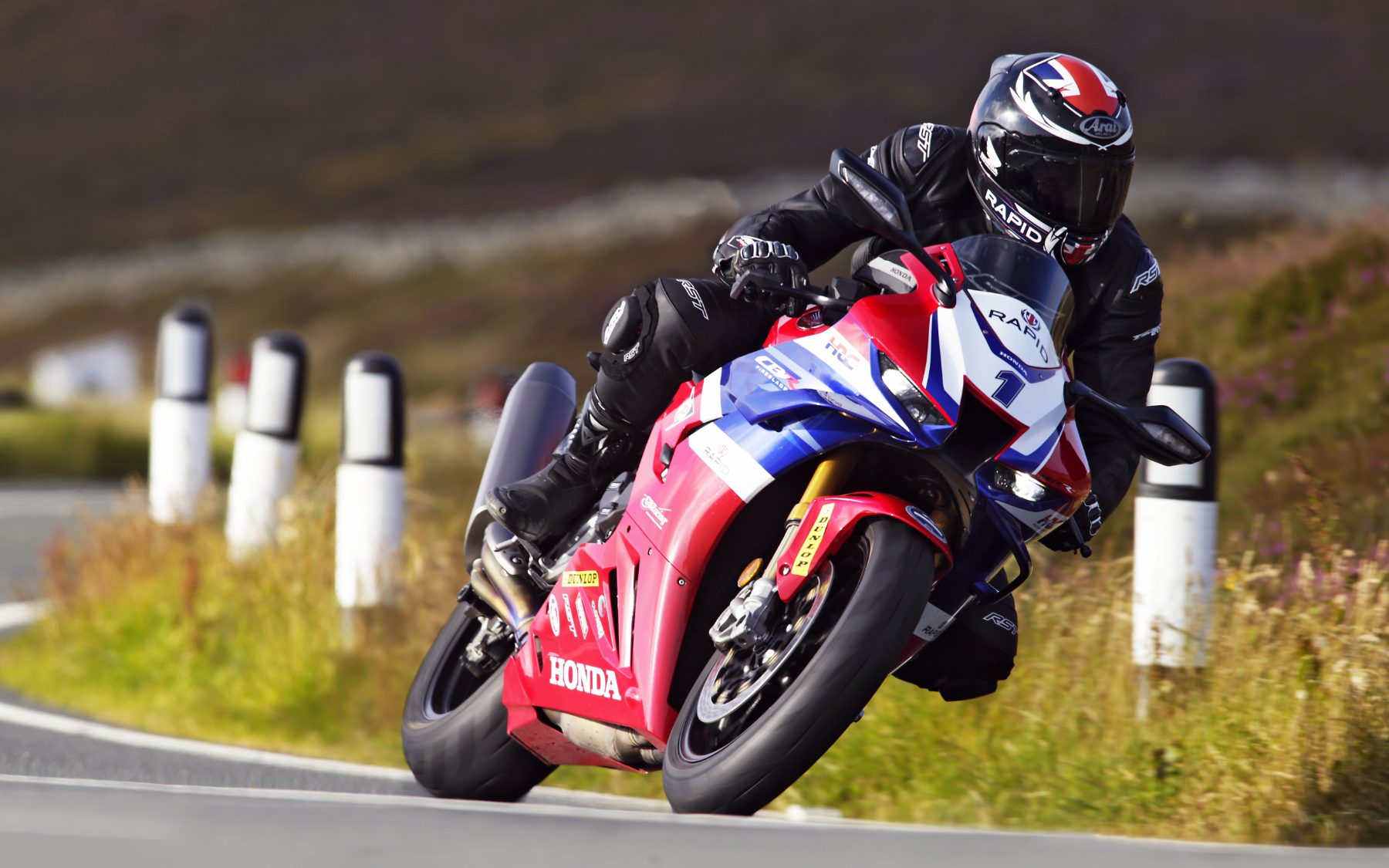 A RAPID coach on a Fireblade, cornering.